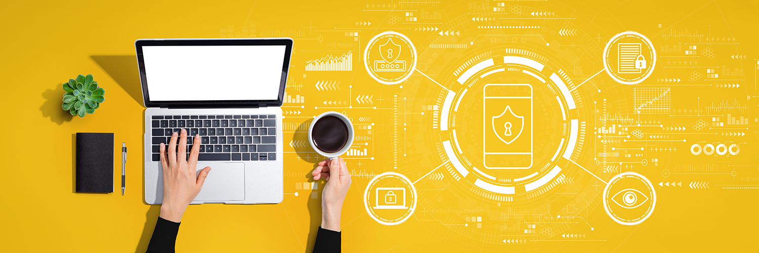 closeup of hands on a laptop computer with an illustration about data privact to the right