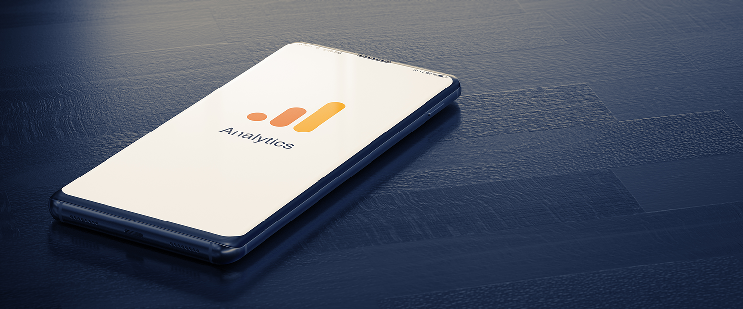 a smartphone on a counter with the google analytics logo on the screen