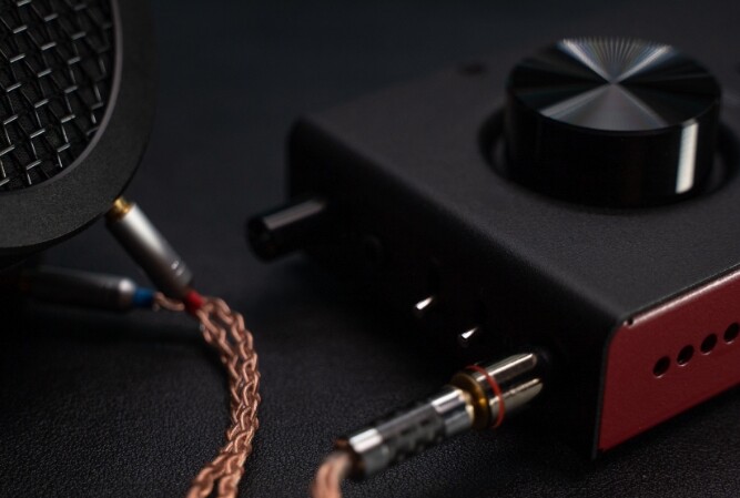 a standalone amplifier with wires hooked up to it