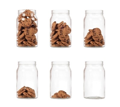 6 glass cookies jars in front of a white background, with decreasing amounts of cookies in each jar from left to right