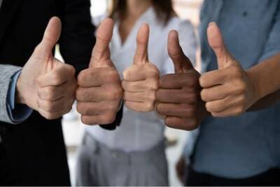 peer recommended 5 hands of different skin tones give a thumbs up