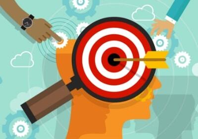 targeted tactic a head seen through a magnifying glass with a bullseye in the brain