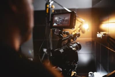 person shooting a video of shower product