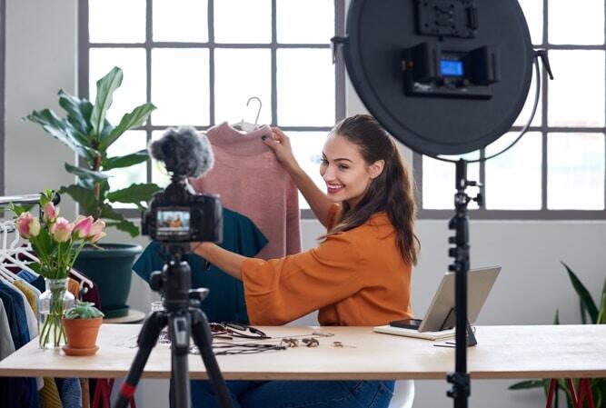 Fashion influencer vlogger creating videos for her channel