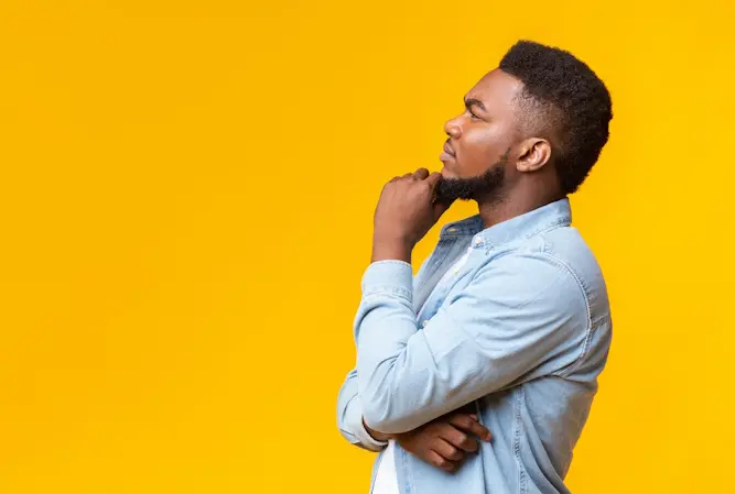 man with hand on chin thinking