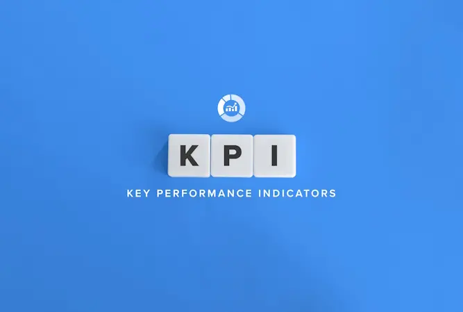 tiles spelling KPI on blue background