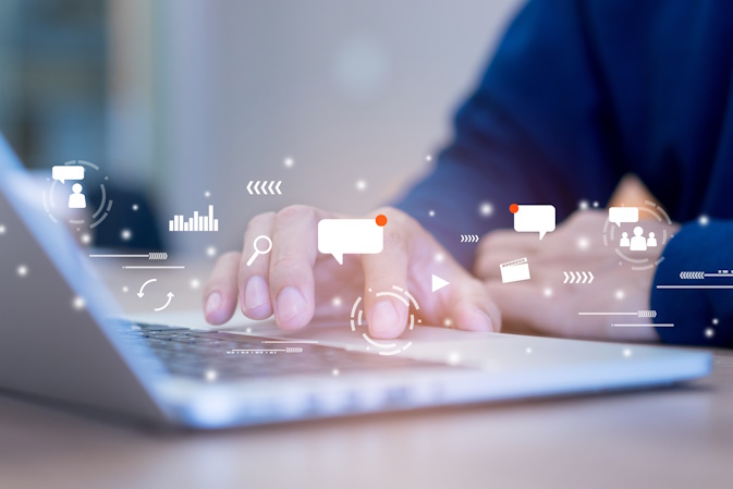 content marketer typing on laptop