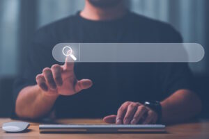man searching online with search bar graphic