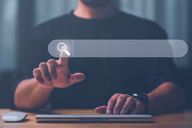 man searching online with search bar graphic